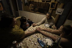 The Alaimo family holds hands after dinner. Three generations of women under one roof provide all of Malcolm's care. Danielle is Malcolm's mother and full-time caregiver, supported by her 13-year-old daughter, Boston, and her mother, Kathy.
