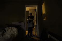 Boston says goodbye to her brother Malcolm before leaving for school. As an eight-year-old, Malcolm is performing academic tasks at the level of a four-year-old and requires specialized education. December 5, 2020. Rochester, NY.