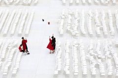 Tossing their graduation caps in the air on the floor of the football field after Rutgers University 256th Anniversary Commencement in Piscataway, N.J., Sunday, May 15, 2022