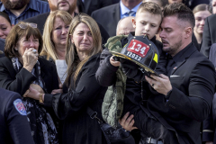 Funeral for FDNY firefighter Jesse Gerhard of Islip, Wednesday Feb. 23, 2022 at St. Patrick’s Roman Catholic Church in Bay Shore. Gerhard died after suffering a heart attack a day after battling a fire. Left to right, Jesse Gerhard's mother Lynn Gerhard, his sister-in-law Kristi Gerhard, his nephew Bradley Gerhard, and his brother Casey Gerhard.