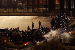 Migrants cross U.S.-Mexico border