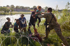 Migrants cross U.S.-Mexico border at Eagle Pass