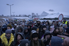 On 24 February 2022, Russia invaded Ukraine in a major escalation of the Russo-Ukrainian War, which began in 2014. The invasion has caused tens of thousands of deaths on both sides and prompted Europe's largest refugee crisis since World War II. The UNHCR records 8,046,560 refugees from Ukraine across Europe as of 30 January 2023, amounting to around 19% of the Ukrainian population. This series chronicles the exodus into Poland at the beginning of the 2022 invasion. 

Ukrainian refugees wait to board buses after crossing the border during snowfall to Medyka, Poland. 09 March 2022. As of January 2023 there are around 8 million Ukrainian refugees outside of the country as the war approaches its one year anniversary.