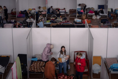 Ukrainian refugees rest in a sports center which has been turned into a temporary shelter in Chelm, Poland. 08 March 2022. As of January 2023 there are around 8 million Ukrainian refugees outside of the country as the war approaches its one year anniversary.