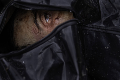 The eye of a dead Ukrainian citizen can be seen in a partially unzipped body bag among dozens of bodies exhumed from the mass grave created at St. Andrews Church during the Russian occupation of Bucha, Ukraine, on 4.4.22. Russian forces prevented Ukrainians from performing funerals, so the Ukrainians created the mass grave behind St. Andrews Church to give their slain neighbors a sense of peace in death that they didn’t have in their final living moments.