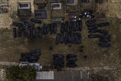After searching streets, homes, and shallow graves across Bucha, body collectors prepare roughly 50 corpses to transport to the morgue in Bucha, Ukraine, on 4.6.22. Washington Post reports that authorities acknowledge that they may never have a complete tally of those killed in Bucha, but investigators estimate 458 people were killed or died in Bucha during the Russian occupation. Only 39 of 458 appeared to have died from natural causes, while many others showed signs of torture or execution.