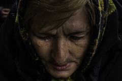 A single tear falls as a community mourns the death of Mykola Dmytrovych in the rural town of Starychi, Ukraine, on 3.16.22.