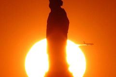 Sunset Behind the Statue of Liberty in New York City