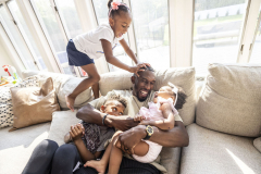 Portrait of Marcus Damas with his kids Maddi, 4,  Melrose, 1, and  Max, 7, Monday June 13, 2022 in West Bay Shore.