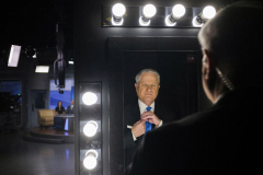 Rob Vaughn adjusts his attire in the mirror before anchoring the 5 p.m. news at WFMZ, on Oct. 27, 2022.