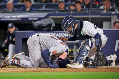 Yankees catcher Jose Trevino checks on injured Houston Astros Kyle Tucker, doubled over on the plate after he fouled the ball into his knee in the 6th inning in game 3 of the ALCS at Yankee Stadium in the Bronx on Oct 22, 2022