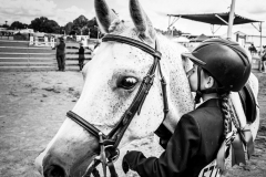 EQUESTRIAN DREAMS - After COVID put a damper on the competitions of previous years, the Chicory Meadow Farm IEA (Interscholastic Equestrian Association) team, compared to the Bad News Bears because the team often lost, was unusually diverse and even included a boy, weren’t on to win some of the top prizes by the end of the season. Annabel kisses the horse she will be riding, Wally, for luck when she and her Chicory Meadow Farm teammates competed at the Dutchess County Fair Horse Show Wednesday, August 24, 2022, in Rhinebeck, NY.