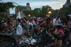 People run out of Washington Square Park after fireworks were mistaken for gunfire following multiple Pride events earlier in the day on June 26, 2022 in New York City. NYPD confirmed there were no shots fired, although moments after several fights broke out resulting in multiple arrests including one person being taken away in an ambulance.