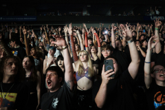 Eden Hoeffling (center), 17, her friend Alex Hansen (center left), 17, and her boyfriend Tyler Swearingin (center right), 18, watch the hip hop duo $uicideboy$ at T-Mobile Center in Kansas City, Mo., on September 27, 2023. The group travelled to Kansas City from Sedalia with Eden for her to watch her first big gig away from home.