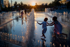 Children frolic in a water feature that has become a popular cooling spot in a new park in the Upper West Side of New York July 4, 2023.