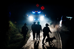 SWAT teams walk in the road in Bowdoin, Maine, as they raid houses during the manhunt for the mass shooting suspect Robert Card, October 26 2023.