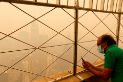NEW YORK, NY - JUNE 7: Heavy smoke from Canadian wildfires fills the air shrouding the view of One Vanderbilt and the Chrysler Building from the 86th floor of the Empire State Building on June 7, 2023, in New York City.