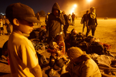 Migrants at an encampment by the U.S.-Mexico Border Wall