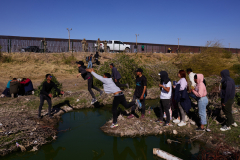 Migrants cross U.S.-Mexico Border