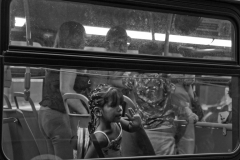 July 31, 2023 A bus arrives at the Roosevelt Hotel with migrant families. Women and children get priority in processing and shelter.