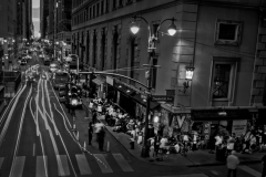 July 31, 2023 This long-exposure of car lights streaking by evening rush hour, as migrants camp outside the Roosevelt Hotel.  Roosevelt Hotel, once considered the grandam of Madison Avenue, now dubbed the new Ellis Island, the latest gateway for NYC immigrants. It exemplified the city's migrant crisis at a critical juncture.