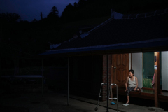 Jeong Gyeong-shim, 86, the oldest person on the island and who has a back pain, and was treated with acupuncture by Kim Gwang-jin, 25, not in the picture, from Jeonnam 511, at the village hall, earlier of the day, spent the night alone at her home, on July 7th, 2022, in Woodo, South Jeolla Province, South Korea. [Story first published January 18th, 2023]