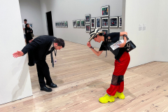 A security guard at the Whitney Museum and a visitor acknowlegde each with  a bow, August 28, 2023.