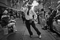 June 10, 2023. Barnard Dove dances at a street corner,  annual Puerto Rican Day in Harlem NYC.
