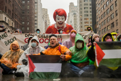 Pro-Palestinian protesters demonstrate on Sixth Avenue during the Macy's Thanksgiving Day Parade, Thursday, Nov. 28, 2024, in New York.