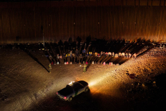 Migrants cross the U.S.-Mexico border at Lukeville, Arizona
