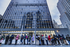 Hundreds of migrants wait in the cold outside the immigration office in Manhattan for their appointments on Wednesday, Jan. 31, 2024.
