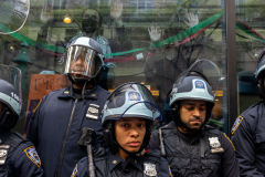 Police set up a perimeter outside a Fordham University administration building where student pro-Palestinian protesters set up a tent encampment in the lobby on May 01, 2024 in New York City. The occupation of the building comes a day after police raided both Columbia University and City College, arresting dozens and closing down encampments there.