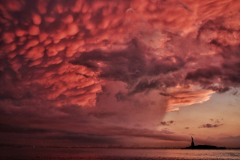 Red Sky at NightA spectacular red sunset behind the Statue of Liberty assures a good day for mariners.