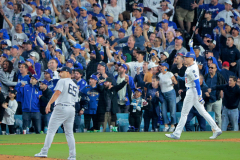 Los Angeles Dodgers first base Freddie Freeman (5) celebrates his walk off homer in the 10th inning as New York Yankees Nestor Cortes watches it during Game 1 of the World Series on Friday, Oct. 25, 2024 at Dodger Stadium in Los Angeles.