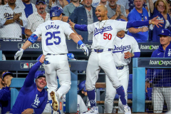 Dodgers outfielder Tommy Edman celebrates with shortstop Mookie Betts after a third inning homer during Game 6 of the NLCS against the Mets at Dodger Stadium in Los Angeles on Oct. 20.