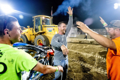 AUGUSTA, NJ USA - AUGUST 5, 2024 -  Dylan Gonnoud, of Wantage, NJ, competing in a 2009 Honda, celebrates with friends after winning the 4-cylinder engine wire heat The second night of the Demolition Derby at the NJ State Fair held at the Sussex County Fairgrounds in Augusta.