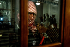 A demonstrator uses a hammer to smash the glass of the entry doors to Hamilton Hall on Columbia University’s campus as protestors barricade themselves inside the school building after the school refused to meet their demands in New York, NY on April 30, 2024. Hamilton Hall has a symbolic significance as a place of student protest and has been occupied five times by student protesters since 1968.