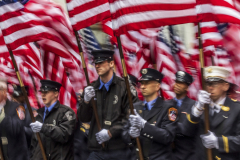 FDNY firefighters march, holding 343 American flags honoring the 343 FDNY members lost on 9/11, during today’s  St. Patrick's Day Parade in New York City.