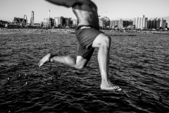 Coney Island, NY USA September 1, 2025- Coney Island Life guards jump off the pier in an annual end of Summer tradition.