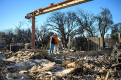 Lisa Price (R) hugs her daughter Madison Price (L) while visiting her home that she raised her two kids in, destroyed by the Palisades wildfire for the first time since they were evacuated on January 14, 2025 in the Pacific Palisades, California. The family has lived in their home for over 20 years. Multiple wildfires fueled by intense Santa Ana Winds are burning across Los Angeles County. Reportedly at least 10 people have died with over 180,000 people having been under evacuation orders. Over 9,000 structures have been damaged or burned while more than more than 25,000 acres were burning from the fires.