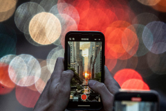 3rd Place: Seth Harrison – USA Today Network- Manhattanhenge - People capture a muted but dramatic Manhattanhenge from an overpass on 42nd Street in Manhattan May 29, 2025. Manhattanhenge is an event during which the setting sun is aligned with the east-west streets of the street grid of Manhattan. The phenomenon occurs over two days, twice each year.