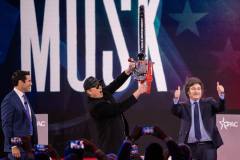 Tesla and SpaceX CEO Elon Musk holds a chainsaw presented to him by the President of Argentina Javier Milei at the Conservative Political Action Conference (CPAC) in National Harbor, Maryland. 20 February 2025