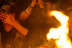 2nd Place: Alexi Rosenfeld – Independent – Fighting for the Hostages - On Oct. 7, 2023, Hamas-led fighters attacked southern Israel, killing about 1,200 people and kidnapping 251 Israelis and foreign nationals, taking them into Gaza.

This picture story follows the hostage crisis through 2025: the families’ fight to keep the captives visible, the rare moments of return, and the funerals for those who did not survive. Before 2025, 109 hostages were released alive, four in October 2023 and 105 during the November 2023 ceasefire.

In early 2025, a new ceasefire-and-exchange process brought home 33 Israeli hostages from Gaza, including eight returned deceased.

From weekly rallies, protests, and marches in Israel and abroad, to the celebration that unfolded in living rooms, to a hostage’s arrival back home, and finally to the grief when only a body returned, these photographs trace the emotional arc of a year of waiting.

What emerges is the hostage crisis as a civilian front. Families turned grief into momentum. Communities turned memory into action. People called for an end to the war, and bloodshed in Gaza. And across borders, strangers showed up week after week, refusing to let the missing disappear into the background of a longer, brutal war.

In October 2025 a  ceasefire agreement took effect with phase one brining the release of the last 20 living hostages, and remaining hostages bodies, the final body came home at the end of January 2026. 


 A protestor with her mouth taped and 470 written on it and her hands tied stands near a fire during an anti-government protest calling for action to secure the release of Israeli hostages, and end the war, a day before a ceasefire is expected to take effect  on January 18, 2025 in Tel Aviv, Israel.