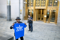 3rd Place: Aristide Economopoulos -Independent- Puffy on Trail -  Sean “Diddy, Puffy” Combs’ celebrity and the lurid accusations against him turned the scene outside the federal courthouse into a spectacle during his racketeering, sex trafficking, and transportation-for-prostitution trial. Traditional network, print, and wire journalists were joined by paparazzi, influencers, bloggers, and gawkers, blurring the line between serious legal proceedings and public entertainment.

Charlucci Finney, friend of Sean "Diddy, Puffy” Combs  holds a shirt prior to the bail hearing. The scene outside the Daniel Patrick Moynihan United States Courthouse for the verdict of the Sean "Diddy" Combs trial.