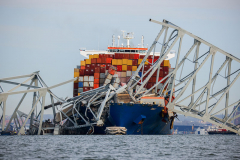 Wreckage of the Francis Scott Key Bridge rests on the cargo ship Dali, Tuesday, March 26, 2024, in Baltimore.