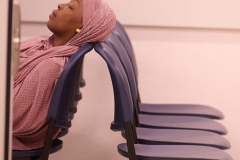 A gets some rest as she waits for her hearing at 26 Federal Plaza on June 11, 2025.