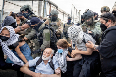 NEWARK, NJ USA - JUNE 13, 2025 - DHS Police clear the gate area of protesters outside Delaney Hall, the privately run immigration detention center where a detainee died in ICE custody and unrest inside the facility has drawn attention to reports of harsh conditions and escapes.