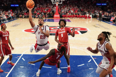 Bryce Hopkins #23 of the St. John’s Red Storm puts up a shot over a falling Taylor Bol Bowen #7 of the Alabama Crimson Tide during the second half of a college basketball game at Madison Square Garden on November 8, 2025 in New York City.