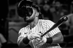 New York Yankees outfielder Jasson Domínguez (24) drives a 3-run go-ahead RBI double during the sixth inning on Jackie Robinson Day, Tuesday, April 15, 2025, at Yankee Stadium in the Bronx, NY. His helmet slipped over his face on the play, but his eye can still be seen through a hole in the helmet.
