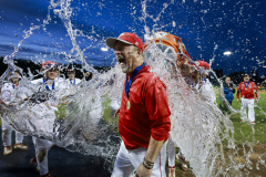 Parkland coach Kurt Weber reacts as he gets the water bucket dumped on him after winning the District 11 Class 6A baseball final on May 29, 2025.